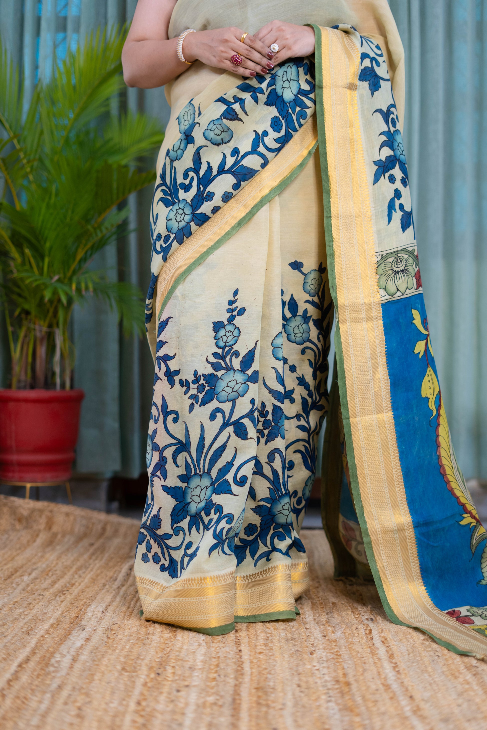 Elegant Beige Kalamkari Saree with Blue Floral Detailing